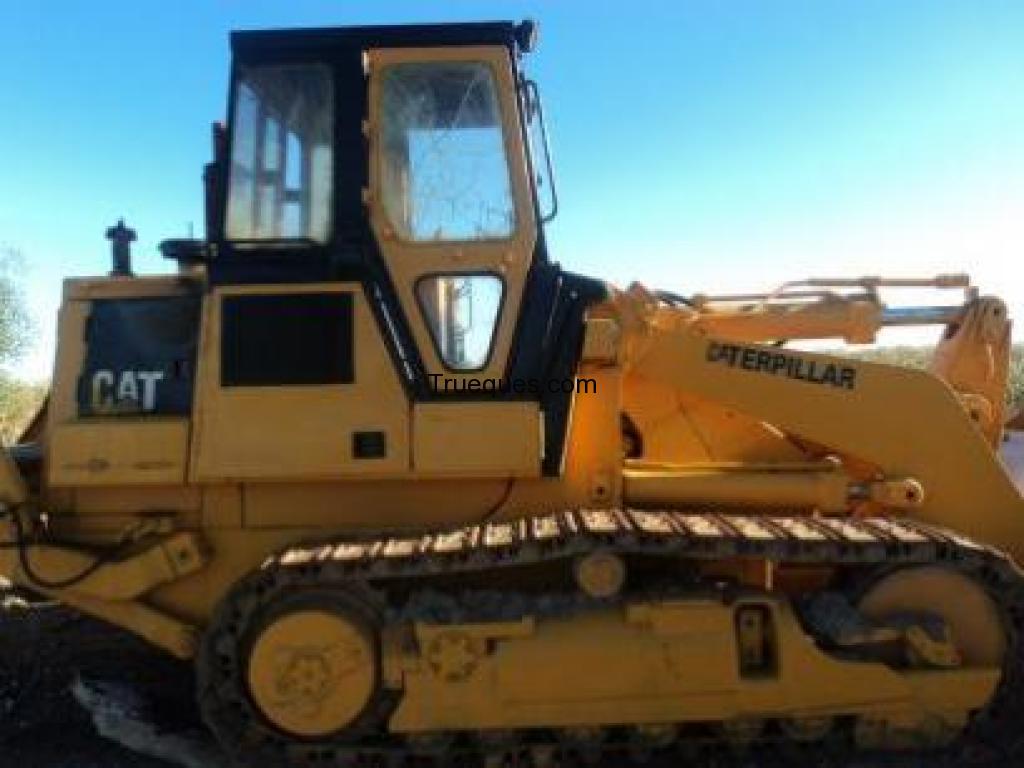 Cambio maquina catepilar 963 cargadora con punchones por pala cargadora de ruedas