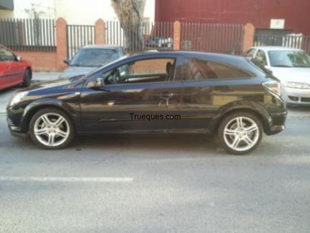 Coche astra gtc por coche cuatro puertas